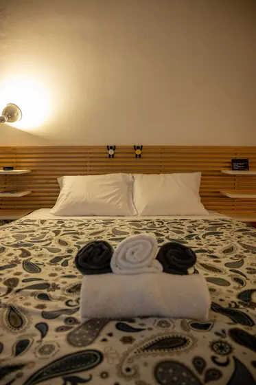 Prepared double bed with towels