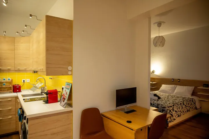Kitchen beside the sleeping and work area