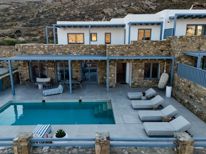 Private pool terrace with chic loungers and shaded outdoor living