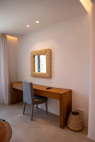 Minimalist vanity nook with warm lighting and natural wood accents
