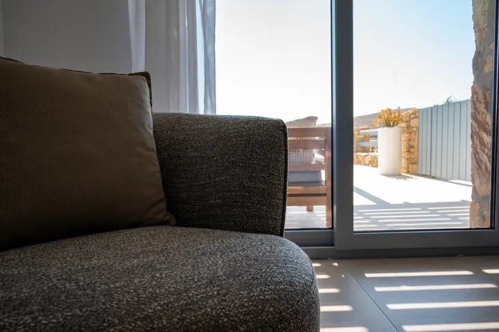 Sunlit lounge corner with sliding doors to a private patio