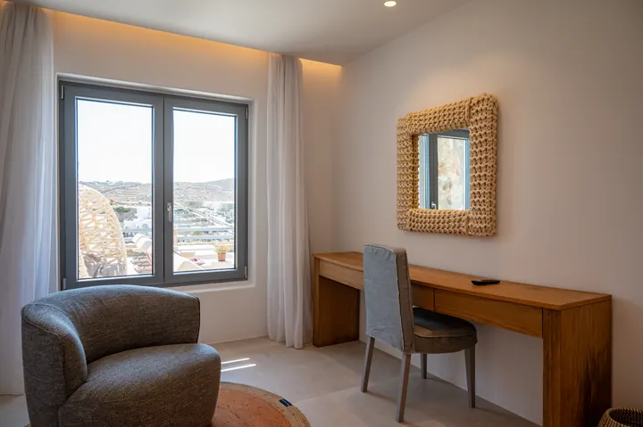 Bright workspace with scenic views and a cozy modern seating area