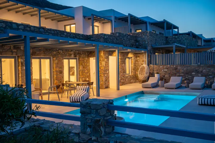 Luxurious stone villa with private lit pool and chic outdoor lounge