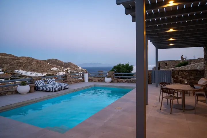 Private pool terrace with sea views and a cozy shaded dining area