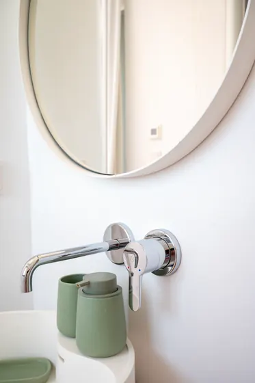 Minimalist modern bath with sleek fixtures and stylish vanity details