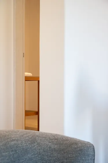 Minimalist interior with warm wood accents and a calm, airy feel