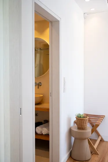 Bright minimalist hall with spa-style bathroom details