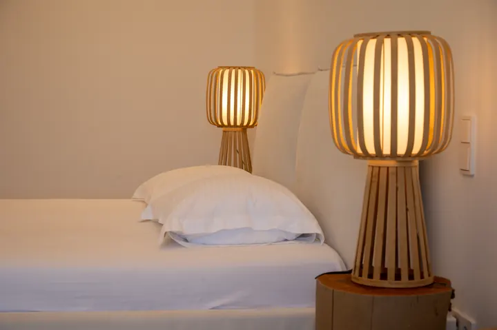 Cozy minimalist bedroom with warm designer lighting