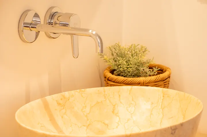 Elegant vessel sink with sleek wall-mounted faucet and spa-like styling