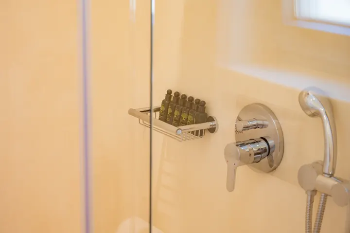 Bright modern shower with glass screen and sleek chrome fixtures