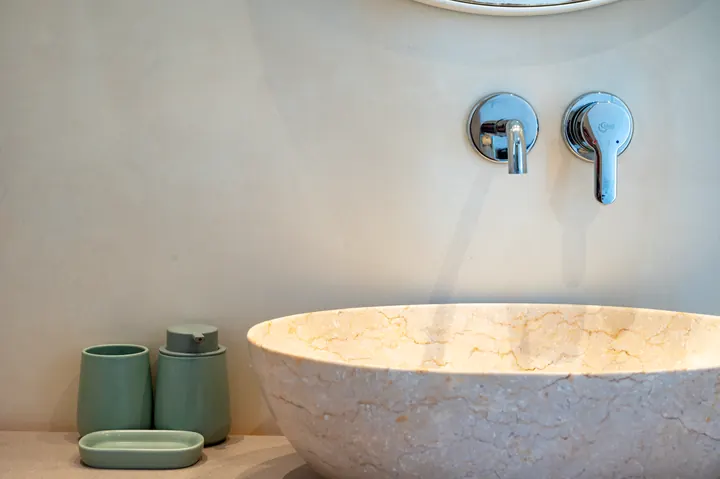 Spa-inspired bathroom with elegant stone vessel sink and sleek finishes