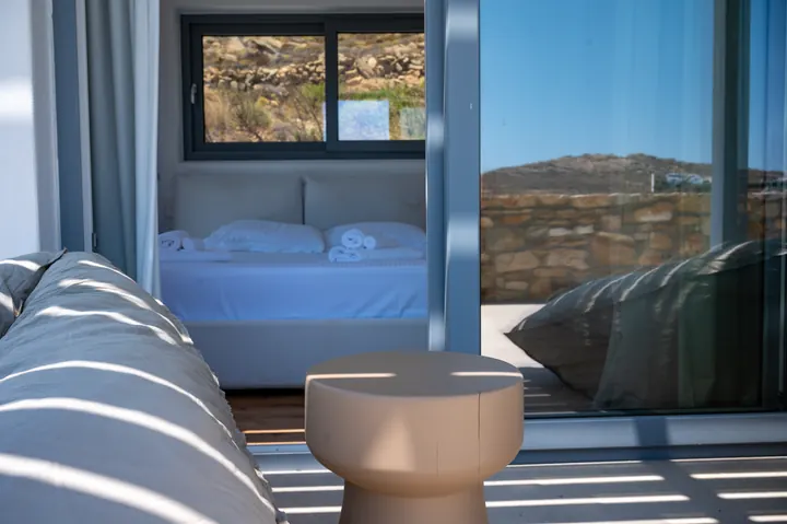 Indoor-outdoor bedroom retreat with private terrace and hillside views