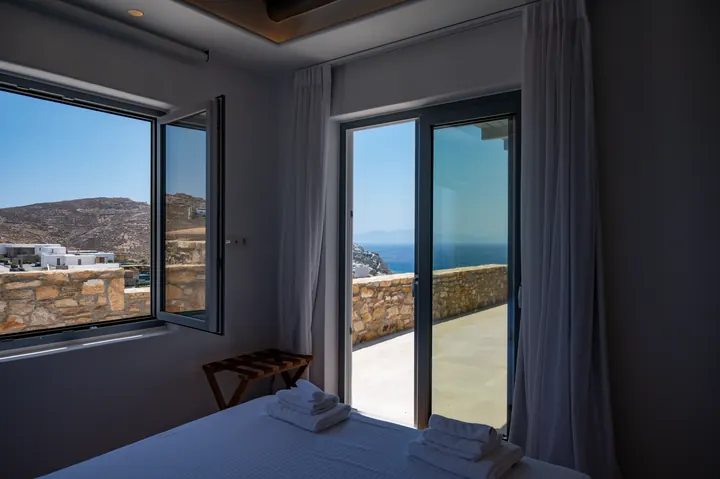 Peaceful bedroom with private terrace and stunning sea views
