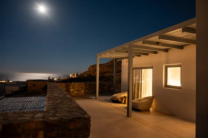 Moonlit sea-view terrace with cozy covered patio seating