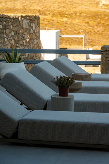 Private terrace with plush loungers and serene resort-style ambiance