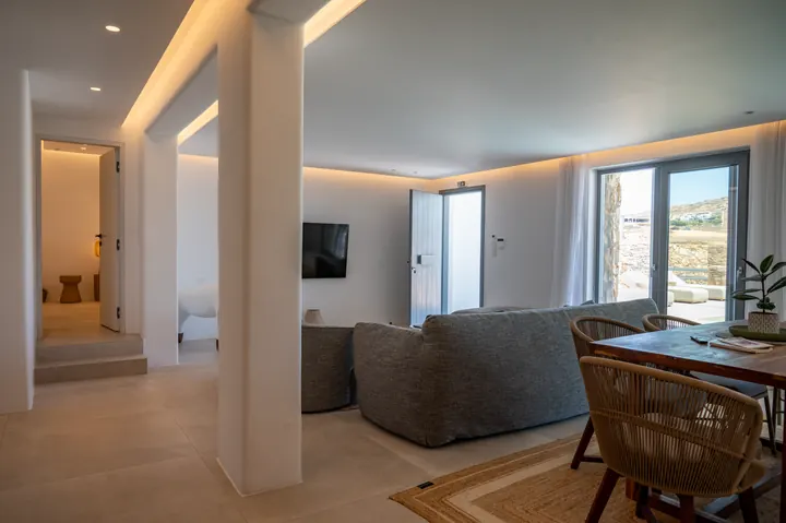 Bright modern living area with soft lighting and scenic outdoor access
