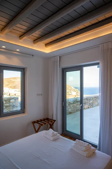 Bright bedroom with terrace access and stunning sea views