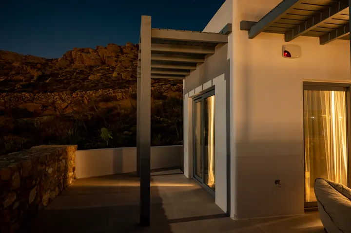Modern desert patio with mountain views and warm evening ambiance