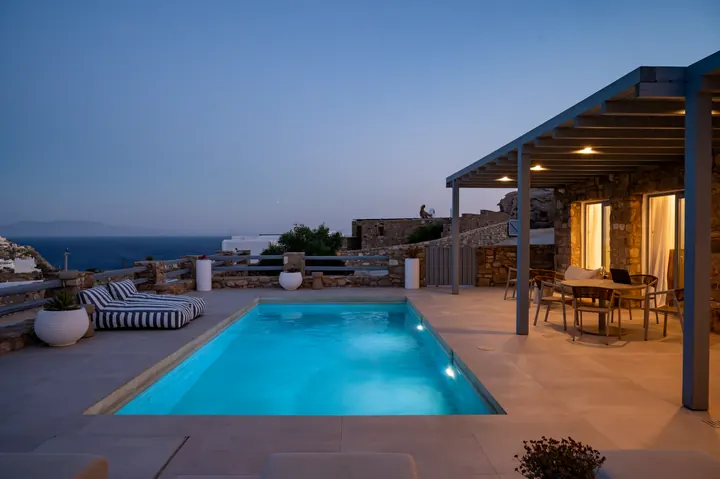 Private pool terrace with sea views and elegant sunset dining space
