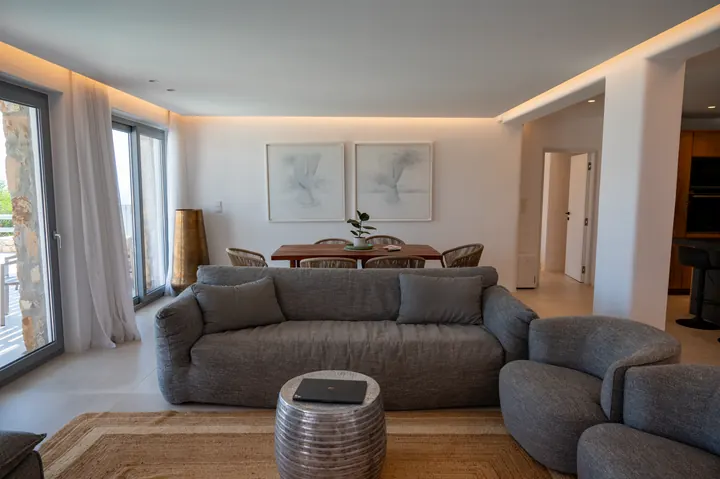 Bright modern lounge with plush seating and terrace access