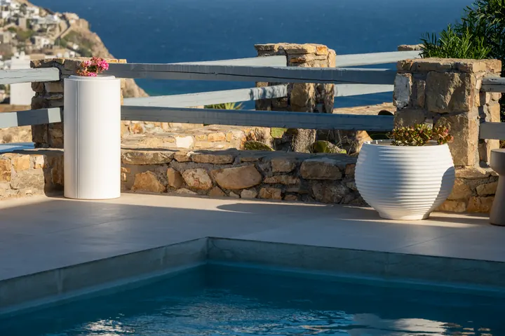 Private pool terrace with stunning sea views and elegant stone details