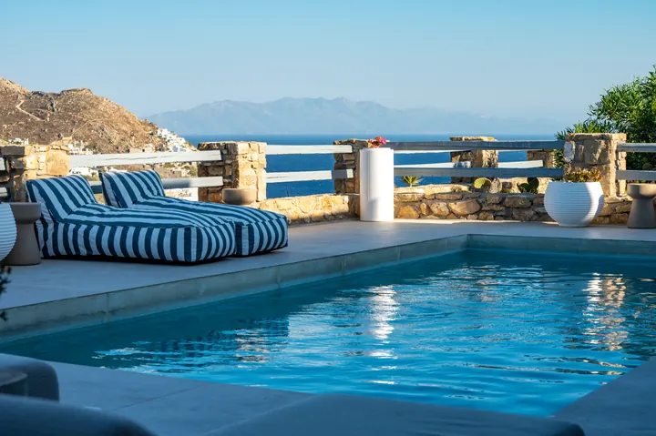 Private pool terrace with chic loungers and sweeping sea views