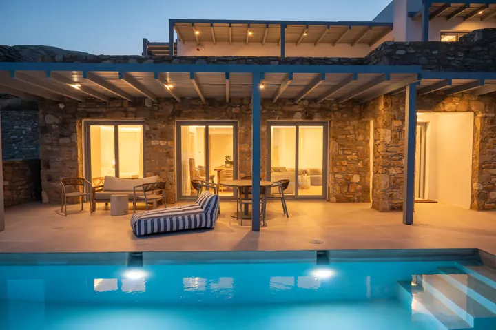 Private pool and covered terrace with warm evening ambiance