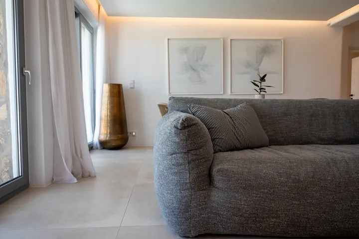 Bright minimalist lounge with plush sofa and elegant natural light