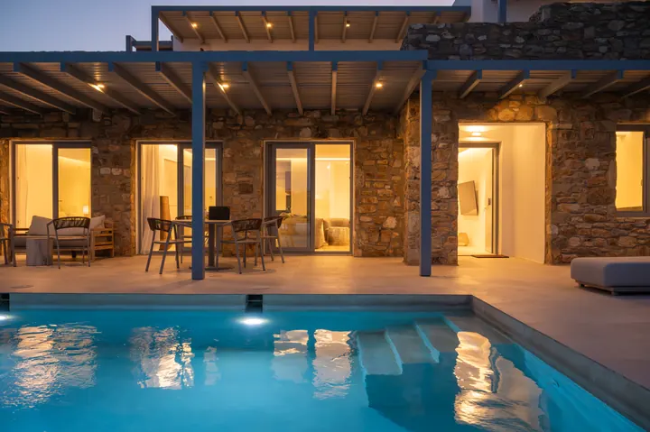 Private pool and covered terrace at a beautifully lit stone villa