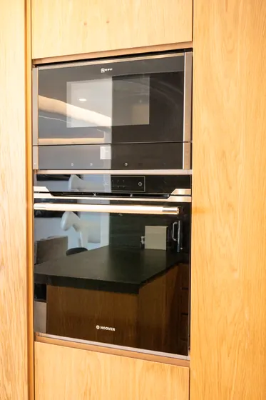Modern built-in oven and microwave with sleek designer cabinetry